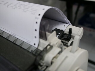 closeup of continuous paper printer in the office,selected focus.