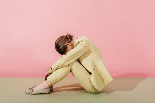 Depressive Woman sitting on floor