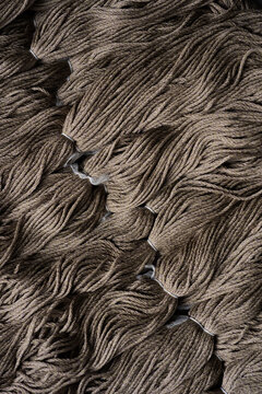 Closeup of silk yarn in taupe shades