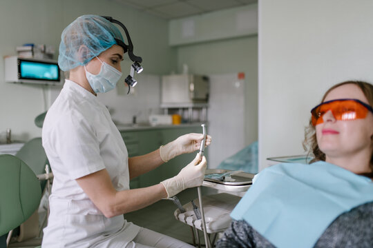 Dentist treating patient