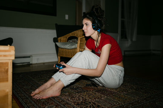 young woman playing video games 