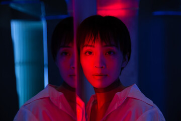 Young woman portrait in warm and cold light