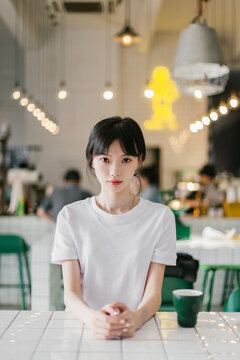A girl sitting in a cafe