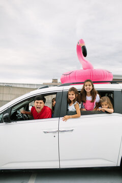 Dad And Daughters Leaning Out Of Car Window, Going On A Trip