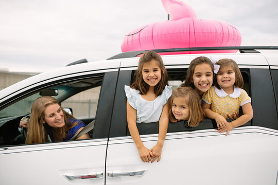 Mom Driving Cute Daughters