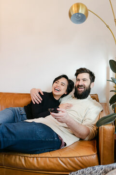 Laughing Couple Watching Comedy