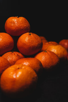 tangerines on black background