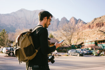 Man on Road trip Using Cell Phone
