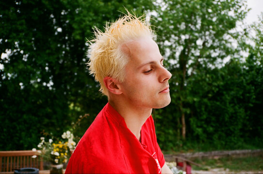 A handsome blond man after dyeing his hairs
