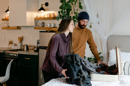 A Woman Packs Her Ex's Clothes
