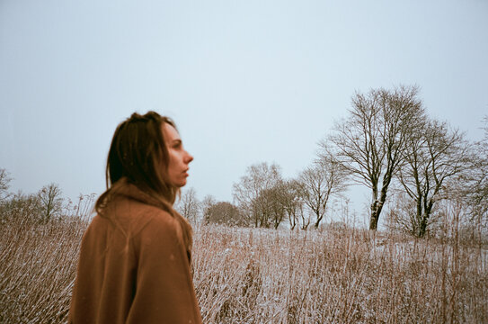 Woman in a field covered with snow
