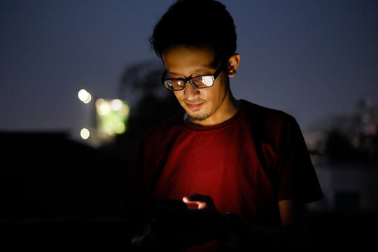 Handsome man using mobile phone 