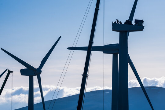silhouette of a mechanic repairing a turbine