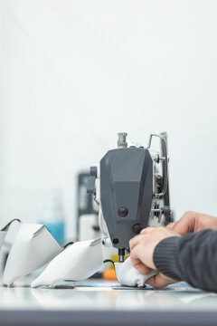 Young woman working with sewing machine