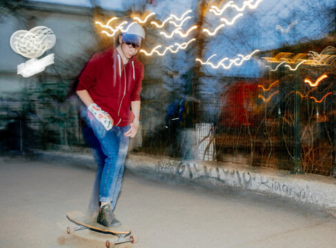 A teenager with a bandage on his arm and a skateboard