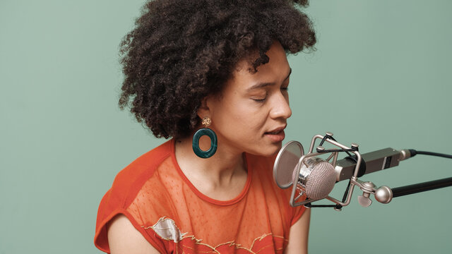 African Woman Singing On The Microphone In The Studio