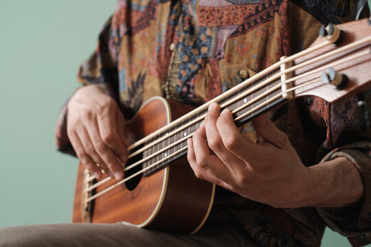 Man Playing Ukulele