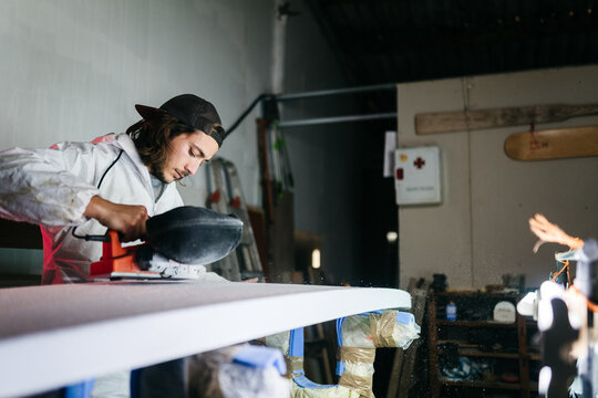 Young man working at his workshop
