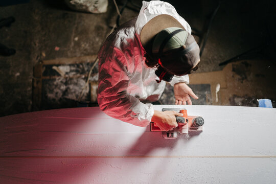 Young man working at his workshop