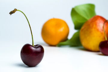 A large cherry on a white background