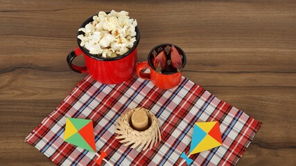 Colorful and cheerful decoration with typical June food on the table, to celebrate the Brazilian June party.