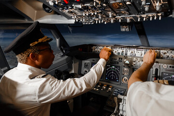 Diverse pilots controlling plane during flight