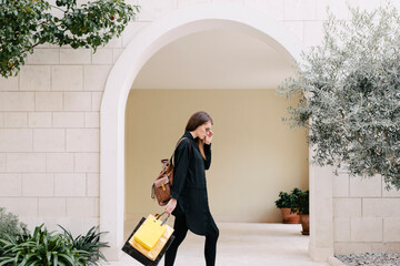 Woman walking with shopping bags