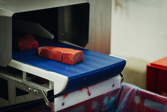 Cutting meat in a meat factory