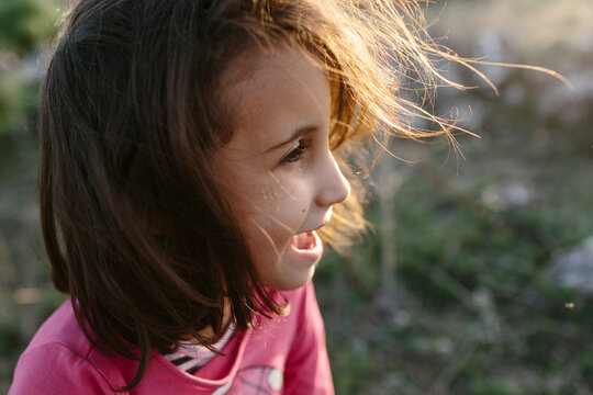 kid laughing outdoors