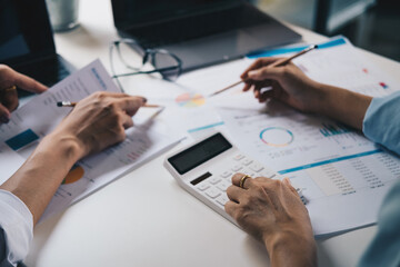 business people adviser meeting to analyze and discuss the situation on the financial report in the meeting room.Investment Consultant,Financial Consultant,Financial advisor and accounting concept.