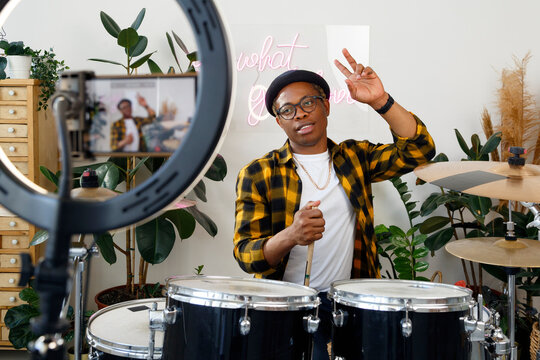 Black drummer greeting vlog audience
