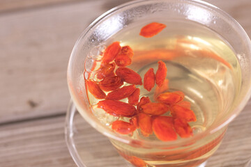Goji berry water soaked in a glass tea bowl