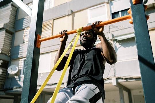 Athletic man  exercising on bars