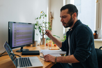 Young adult man having a business video call conversation 