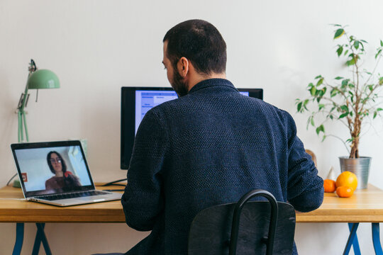 Young adult man having a business video call conversation 