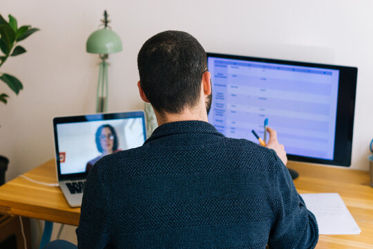 Young adult man having a business video call conversation