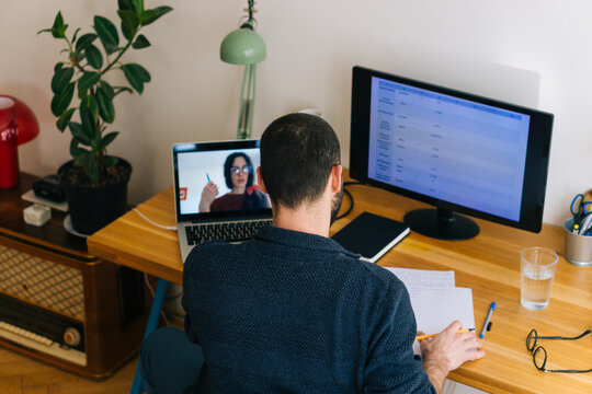 Young adult man having a business video call conversation 