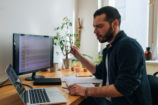 Young adult man having a business video call conversation 