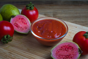 Ketchup bowl with tomatoes and guava