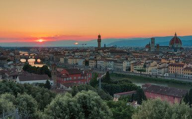 Fototapeta na wymiar Florence, Italy -20 June, 2019 : panorama of the city at sunset, view from Piazzale Michelange to Cathedral of Santa Maria del Fiore, known for its red-tiled dome and Torre di Arnolfo - 95m-tall tower