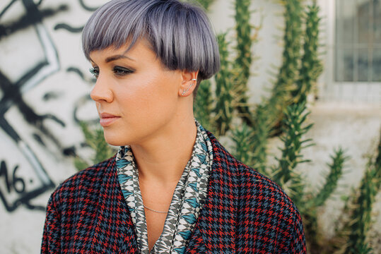 Portrait of a woman with make up and trendy lilac haircut 