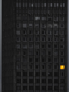 Dark office skyscraper in the evening