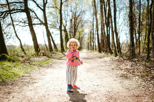 Little blond girl in the forest