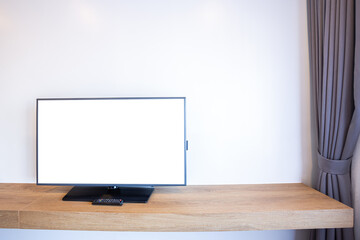 Monitor led television or TV with empty white screen beside the window on brick wall interior room in hotel