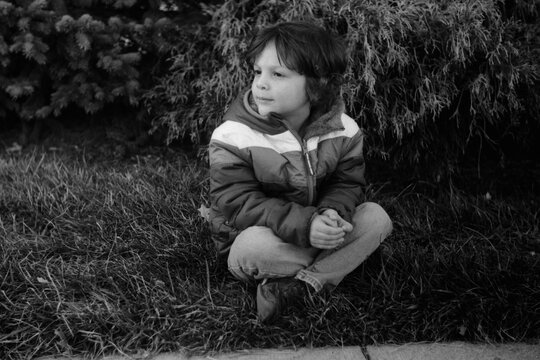 Portrait of a young boy wearing a parka