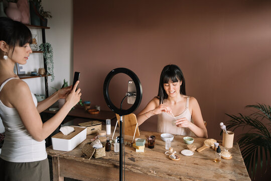 Young Asian Woman Recording A Online Video Skincare Tutorial