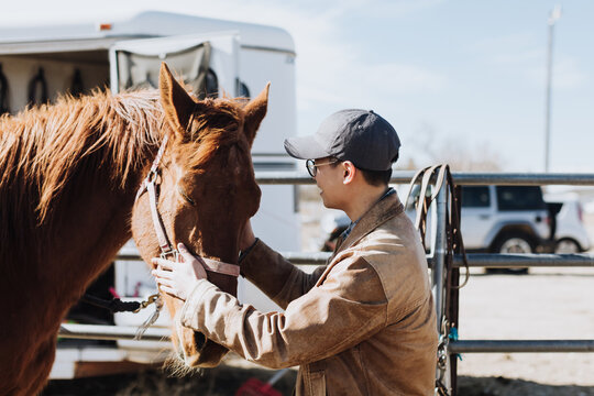 Happy Man Petting Horse