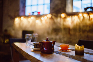 Tea Cups and Pot on Table