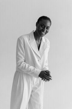 Trendy Black Woman In white suit In Studio