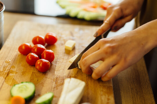 Close Up Woman Slicing Cheese 